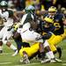 Michigan defense tackles Michigan State ball carrier on Saturday. Daniel Brenner I AnnArbor.com
